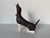 Charming vintage handcrafted wooden dachshund dog figurine featuring a beautifully elongated body, hand-painted black and...