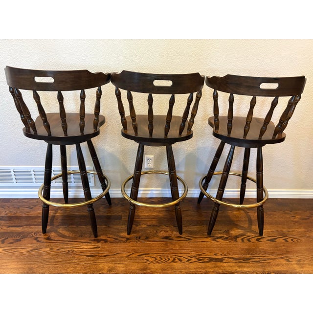American Vintage Yugoslavian Captain’s Mate Wood Swivel Bar Stools With Brass-Tone Footrests — Set of 3 For Sale - Image 3 of 12