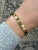 This classic bracelet by Cartier in their iconic LOVE Collection contains ten round brilliant cut diamonds weighing 0.96...