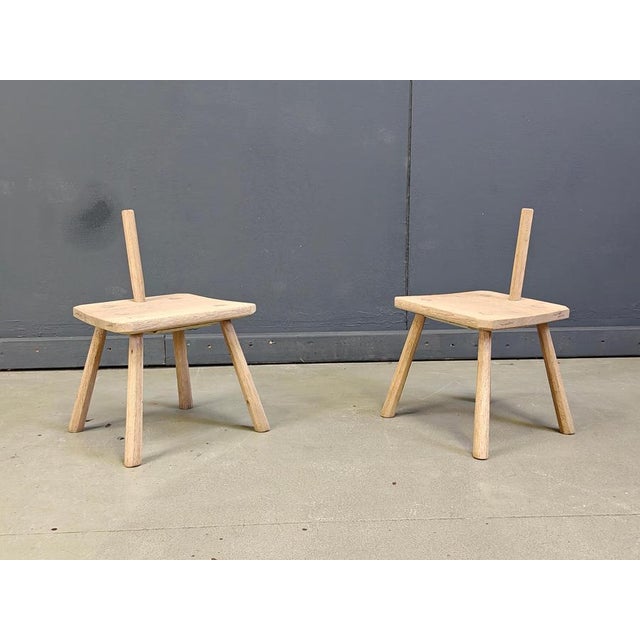 Pair of elegant vintage rustic wooden farm stools, probably used to milk cows. these stools are very decorative; brutalist...