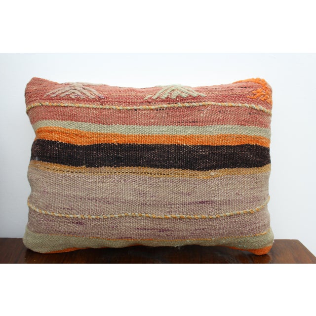 This Turkish pillow cover is made from the highest quality vintage Kilim in 100% wool on the front. The back is covered in...