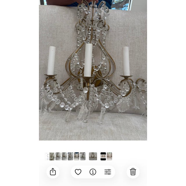 Pair of Czech/Bohemian-style gilt metal and crystal chandeliers featuring scrolling frames, faceted crystal drops, floral...