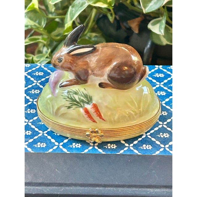 This porcelain lidded box is made for Tiffany in Limoges, France. Tiffany partnered with Limoges to have artisans produce...