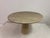 This elegant round dining or centre table is crafted entirely from solid Italian travertine, showcasing the timeless...