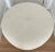 Large and trendy, circular ottoman from 70's. Newly upholstered with a vintage striped textured off white fabric. New...