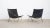 Pair of stainless steel and black leather armchairs, model pk 22 by designer poul kjaerholm for danish manufacturer fritz...
