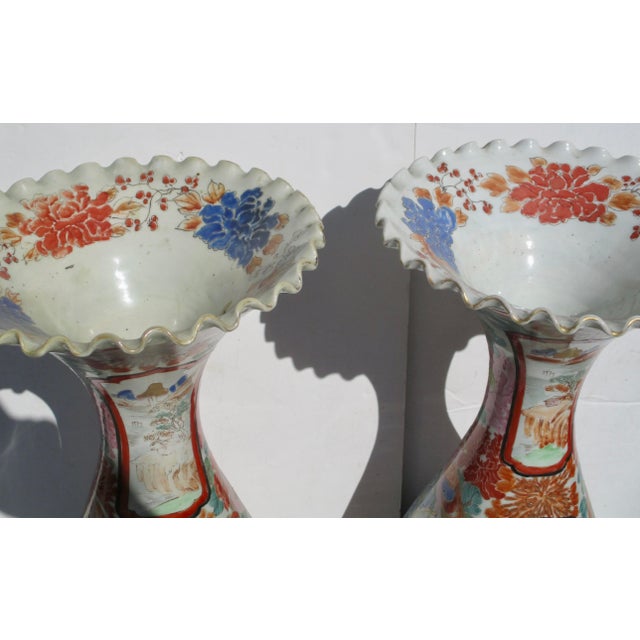 The beautiful Imari porcelain vases in this pair are superb demonstrations of Japanese art and design. Each vase is...