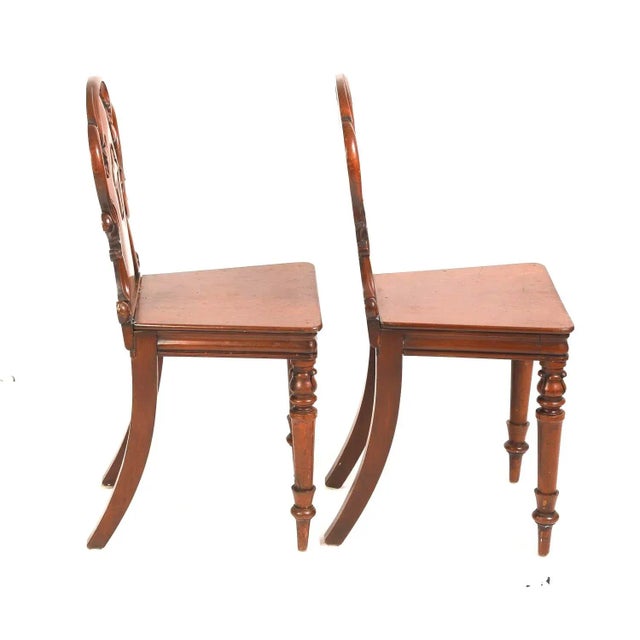 A very fine pair of early 19th Century William IV Mahogany Hall Chairs, hand-carved with rich patination and grain. Chairs...