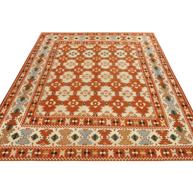 Handwoven in wool originating from Turkey circa 1950-1960, a vibrant vintage Balkan flatweave rug enjoying nomadic...