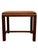 Vintage mid century modern bench stool featuring a solid wood frame with a warm brown finish and an upholstered seat. The...