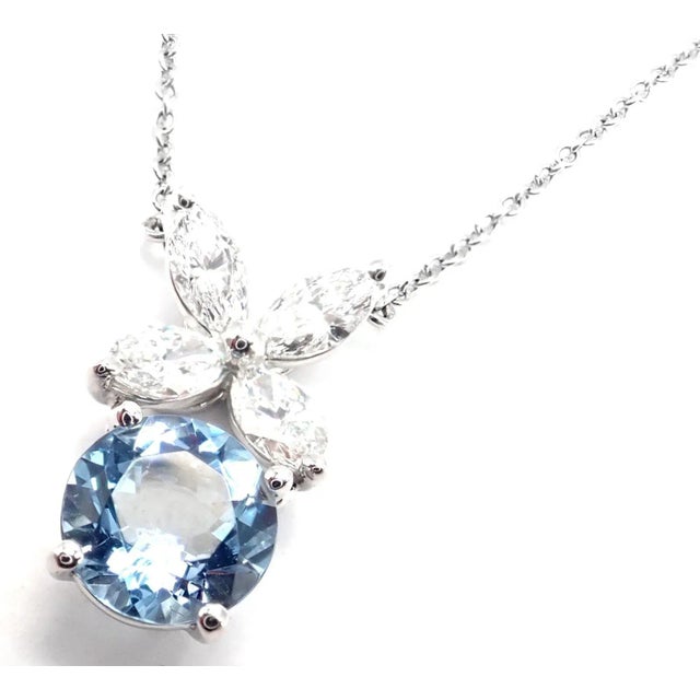 About the Piece: Metal: Platinum Measurements: Chain Length: 16.5" Pendant: 16mm x 10mm Weight: 4.2 grams Stones: 4...