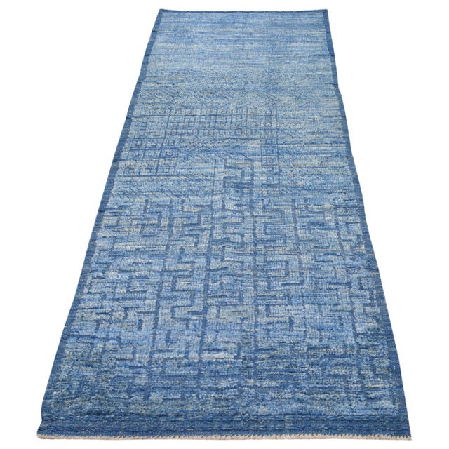 Hand-knotted with care using traditional rug making techniques, this wool rug blends timeless craftsmanship with a modern...