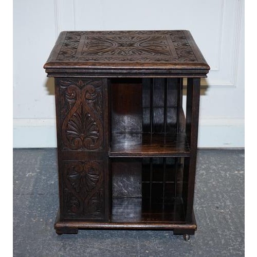 This is a stunning Antique Victorian English Solid Oak Revolving Bookcase in the Jacobean style, beautifully hand-carved...