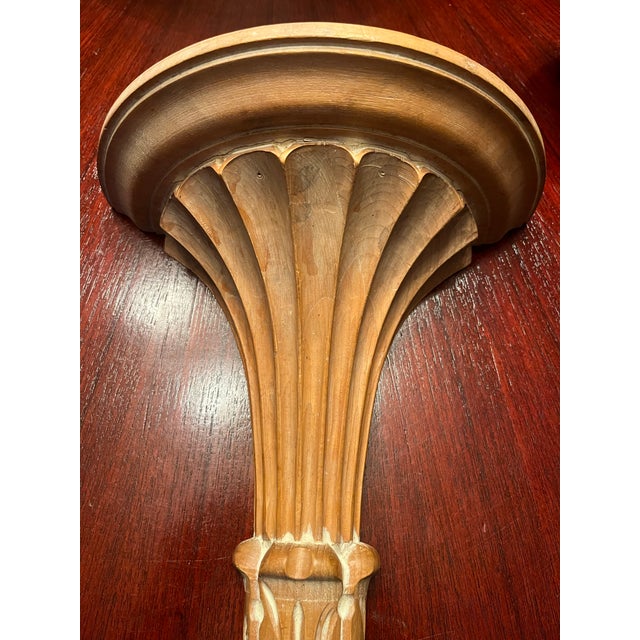 A refined pair of mid-20th century Italian wall brackets, crafted in the Neoclassical Revival style. These sculptural...