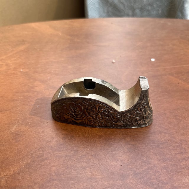 Up for consideration is a beautiful small silver etched tape dispenser with floral details. This would look lovely in your...
