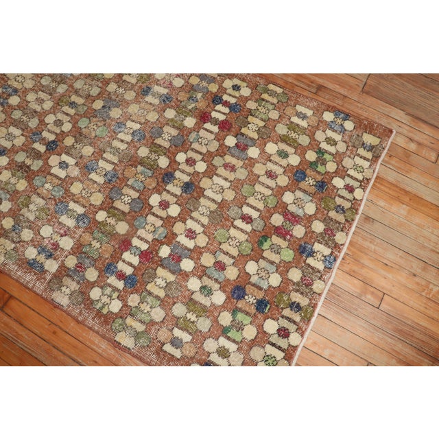 A vintage Turkish deco rug with an all-over borderless design in rustic tones. Measures: 3'10'' x 8'3''.