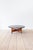 The coffee table features a striking top made of dark slate with beautiful fossil inclusions and an oak base. It most...