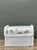 This vintage braided white rattan ottoman captures the relaxed elegance of Mid-Century Modern design, pairing a tightly...