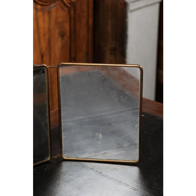 A French three part mirror from the 19th century, with Rococo style painted décor. Created in France during the 19th...