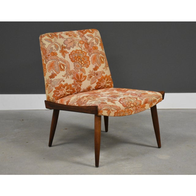 A mid century modern walnut lounge chair with orange and white fabric made by Kroehler Furniture. Fabric in good overall...