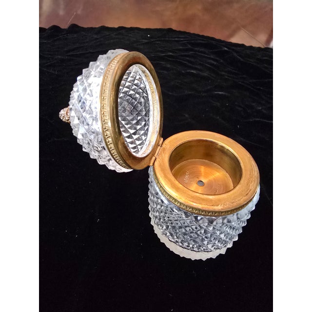 A fine vintage mid century modern original Baccarat style crystal and bronze dome shape box . Having a desirable...