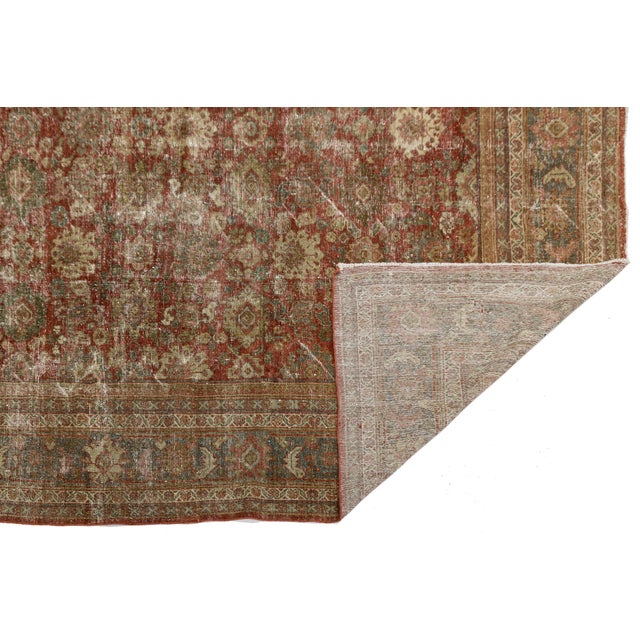 Exuding timeless refinement and historic character, this Antique Persian Mahal Rug features a captivating, gently...