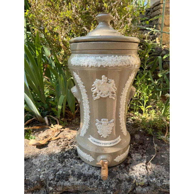 French 19th c water filter with applied ceramic moldings with makers mark. 11” dia x 21”h 49-110