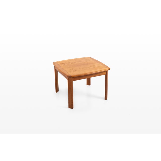 Danish modern coffee table in teak, produced by glostrup møbelfabrik, denmark. The table features a square top with softly...