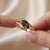 Embrace subtle sophistication with this distinctive bypass ring set with a rich marquise-cut Smoky Topaz (Smoky Quartz)....