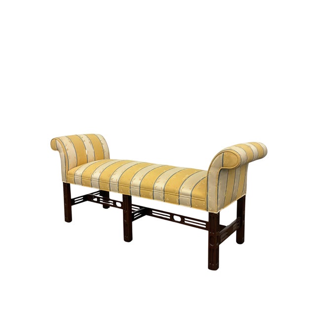 Elegant vintage Chippendale-style upholstered window bench featuring gracefully rolled arms and a beautifully detailed...