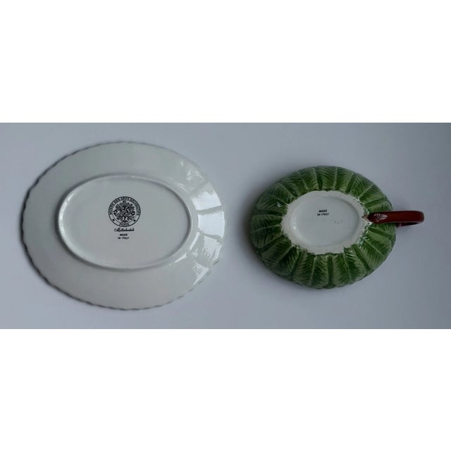 Bring botanical elegance to your table with this **Vintage Mottahedeh Majolica Leaf Cup & Saucer, Made in Italy**....