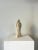 A French Mid Century carved stone sculpture with a fluid yet still form that evokes calm. This hand made piece depicts a...