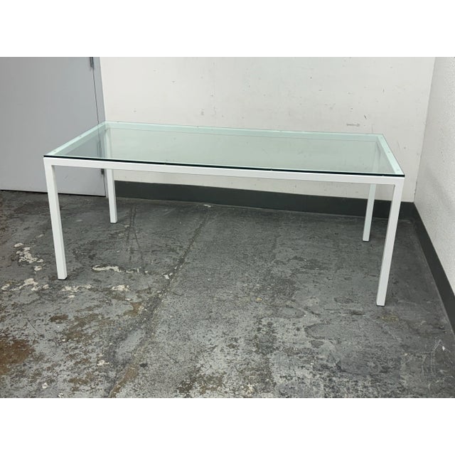 Design Plus Gallery presents a Parsons Table from Room & Board. The table has straight legs of white that are connected...
