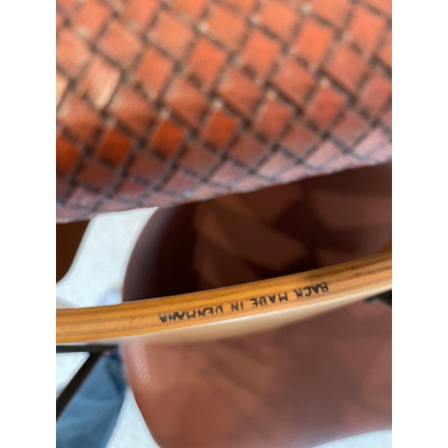 Pair of original Kofod-Larsen Penguin Chairs. Original vinyl and bent wood back, iron legs. Made in Denmark label, circa...