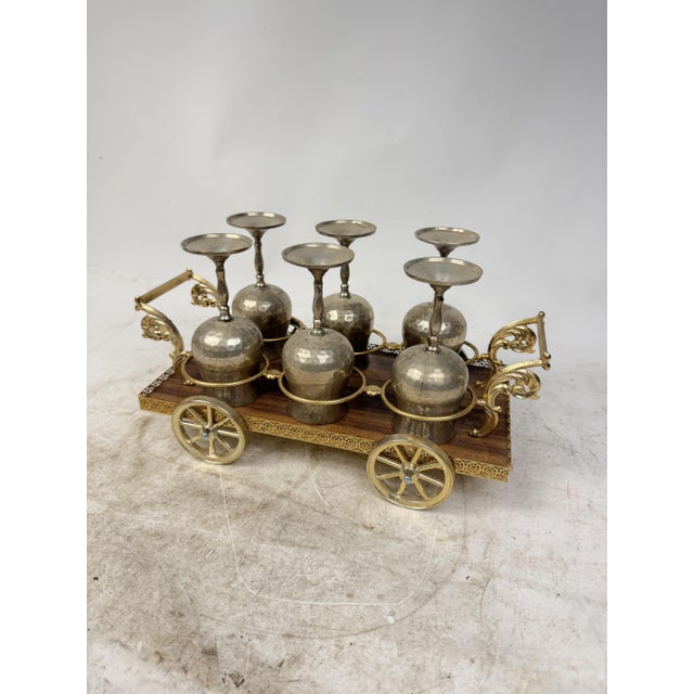 Beautiful and elegant carriage-shaped wood and metal cup holder with hand-hammered, silver-plated metal glasses. An...