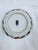 A hand-painted Japanese Arita porcelain bowl with a scalloped rim, featuring the classic Imari palette of cobalt blue,...