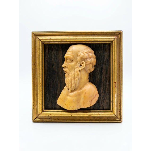 The profile depicts Socrates (c. 470–399 BCE), recognizable by his iconic features. Ancient artists traditionally...