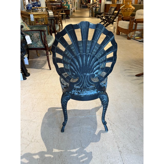 Make a statement with this extraordinary set of four vintage iron grotto chairs, featuring iconic shell fan backs and...