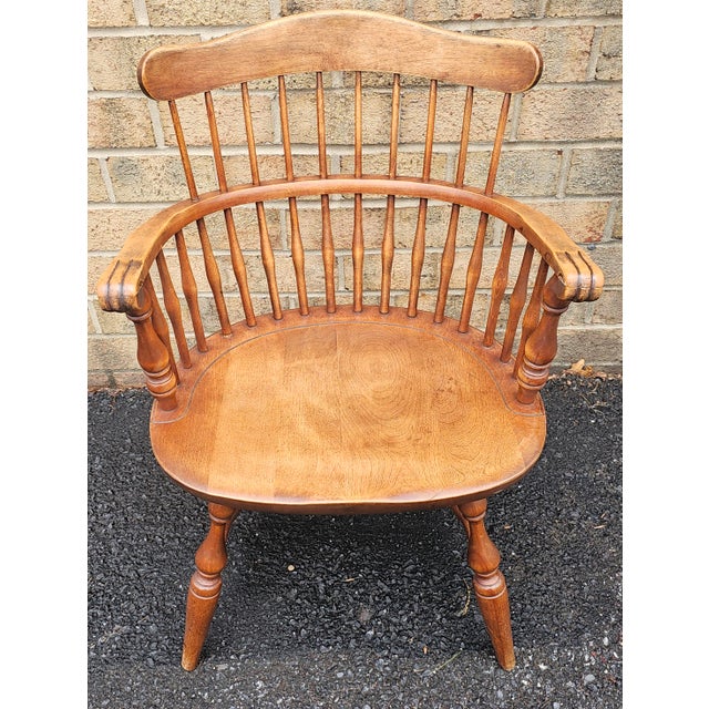 A mid Century maple comb back Windsor armchairs by Nichols and Stone. Measures 23.5" w x 21"D x 32.25"H.