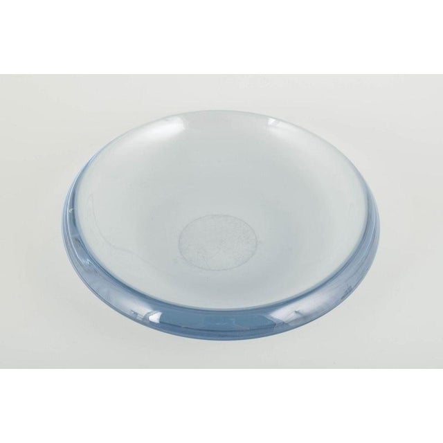 Scandinavian glassworks Art glass bowl, 1970s. Organically shaped mouth-blown bowl in light blue, almost transparent glass...