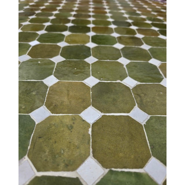 Beautiful handcrafted Moroccan mosaic table featuring an elegant color palette. Measuring 40 inches in diameter, this...