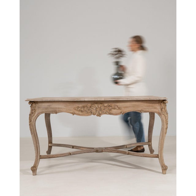 This piece presents as a console table, distinguished by natural bleached oak, carved scroll bracket. Originating in...