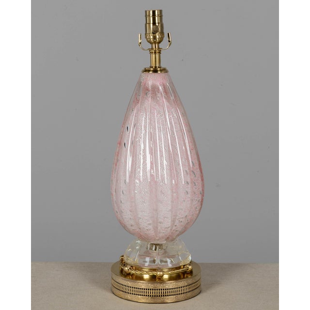 A Mid Century Murano glass lamp by Barovier & Toso. Hand-blown cased glass with cordonato (rope) form and bullicante...