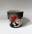 Studio pottery vessel or bowl with Raku interior. Textural exterior of two figures with clasped hands underneath a heart....
