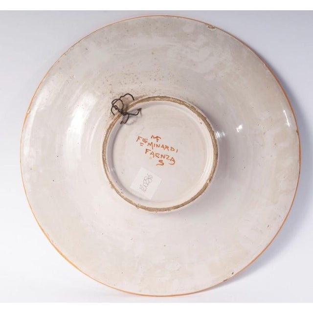 Important Plate Fratelli Minardi Faenza 1920 Lady's profile, a polychrome ceramic plate with a wide rim and a deep recess,...