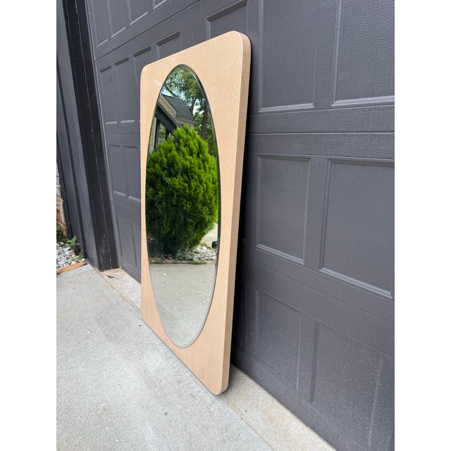 Elevate your space with this sophisticated contemporary wall mirror featuring a distinctive pearlescent frame in a soft...