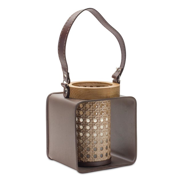 Elevate your space with this elegant Metal Candle Holder featuring a stylish blend of iron, wood, and leather accents. The...