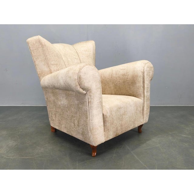 Striking italian mid century lounge armchair from the 1950s, fully refurbished and professionally reupholstered in elegant...