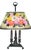 A Pairpoint reverse painted glass table lamp, dated circa 1915 - 1920, showcases a cheerful floral design shade on a green...