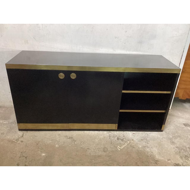 Black Lacquered and Brass Sideboard from Mario Sabot, Italy, 1970s, in Good conditions. Designed 1970 to 1979 This piece...